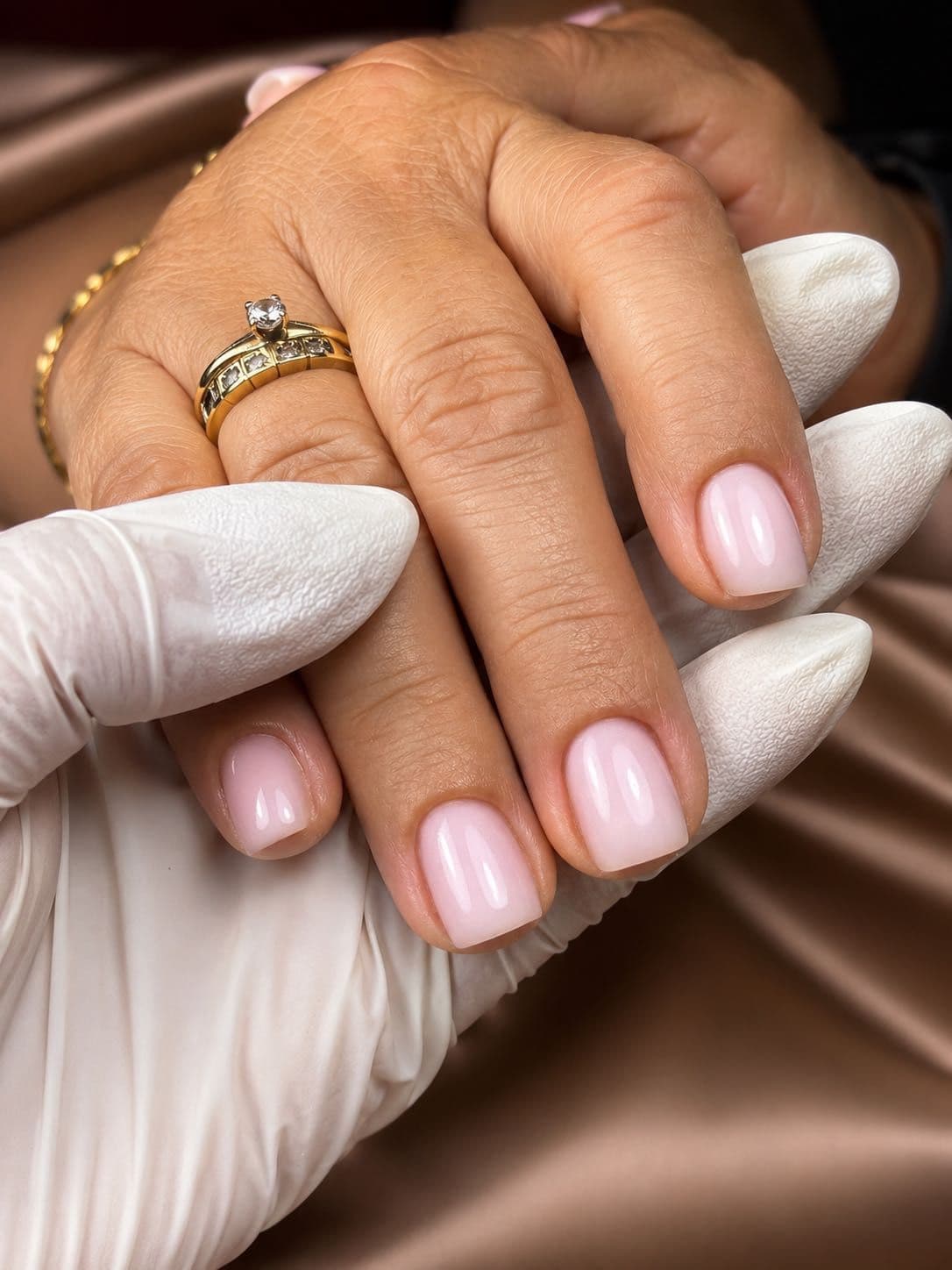 Short square manicure in soft pink with a glossy finish